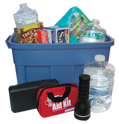 	A storage box of emergency supplies including a first aid kit, flashlight, water bottles, and crackers.