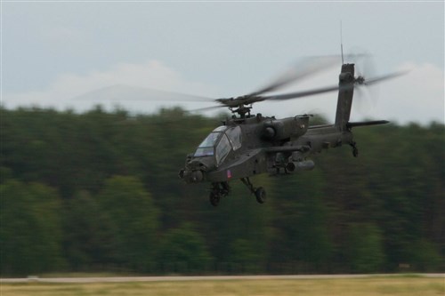 Soldiers with the 2nd Battalion, 159th Attack Reconnaissance Battalion, 12th Combat Aviation Brigade take off in a Boeing AH-64 Apache helicopter June 18, 2015, in Mirosławiec, Poland, during Saber Strike 15. Encompassing more than 6,000 participants from 13 different nations, Saber Strike is a long-standing U.S. Army Europe-led cooperative training exercise. Designed to improve joint operational capability in a range of missions as well as preparing the participating nations and units to support multinational contingency operations, this year's exercise takes place across Estonia, Latvia, Lithuania and Poland. (U.S. Army photo by Spc. Marcus Floyd, 13th Public Affairs Detachment)