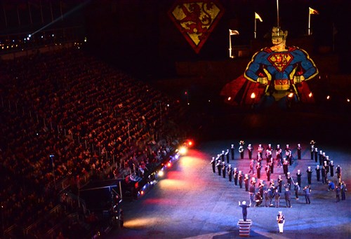 U.S. Naval Forces Europe Band musicians perform the theme song to "Superman" as technicians project a superhero image onto Edinburgh castle during a Royal Edinburgh Military Tattoo dress rehearsal for charities and local Edinburgh citizens. This military tattoo brings together musicians, dancers and bagpipers from around the world to perform in Europe’s most prestigious military tattoo and this year marks the first time since 1950 that a Navy band has performed in the show.