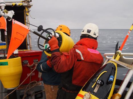 Researchers prepare to drop a buoy into the Arctic Ocean. Scientists sponsored by the Office of Naval Research have traveled to the region to study the changing environment-and provide new tools to help the U.S. Navy operate in a once-inaccessible area. (Photo courtesy of Jim Thomson from the University of Washington/Applied Physics Laboratory)