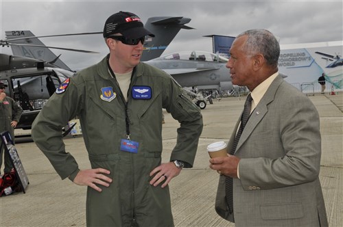 U.S. Air Force 1st Lt. William Graeff, 492nd Fighter Squadron pilot talks with Charles Bolden National Aeronautics and Space Administration administrator July 10, 2012, during the Farnborough International Air Show in Farnborough, England. Approximately 90 aircrew and support personnel from bases in Europe and the United States are participating in the air show. Participation in this premier event demonstrates that U.S. defense industry offers state-of-the-art capabilities vital for the support and protection of our allies’ and partners’ national-security interests.