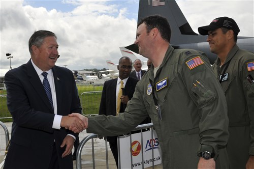 Secretary of the Air Force Michael Donley shakes hands with Capt. Jay Blinn, 3rd Airlift Squadron pilot, July 10, 2012, during a visit to the Farnborough International Air Show in Farnborough, England. Approximately 90 aircrew and support personnel from bases in Europe and the United States are participating in the air show. Participation in this premier event demonstrates that U.S. defense industry offers state-of-the-art capabilities vital for the support and protection of our Allies’ and Partners’ national-security interests.