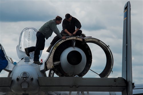 U.S. Air Force crew chiefs from the 354th Expeditionary Fighter Squadron perform maintenance on a U.S. Air Force A-10 Thunderbolt II attack aircraft engine during a theater security package deployment to Lask Air Base, Poland, July 9, 2015. The U.S. and Polish air forces will conduct training aimed to strengthen interoperability and demonstrate the countries' shared commitment to the security and stability of Europe. (U.S. Air Force photo by Staff Sgt. Christopher Ruano/Released)
