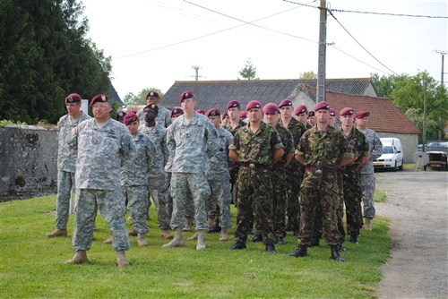 ANGOVILLE AU PLAIN, France – U.S. and British troops took part in a ceremony at Angoville au Plain – where Soldiers from the 101st Airborne Infantry Division fought during the D-Day operations. In 2006, a stained glass window was dedicated to the Screaming Eagles in the church, which had served as a medical aid station for German and U.S. forces during the fighting. 