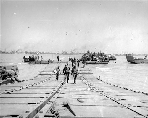 U.S.  Navy Seabees land at Normandy during World War II. Seabees were 
among the first to go ashore as members of naval combat demolition units. With U.S. Army Engineers, they shared the crucial task of destroying steel and 
concrete barriers Germans built in the water and on the beaches to 
forestall amphibious landings.