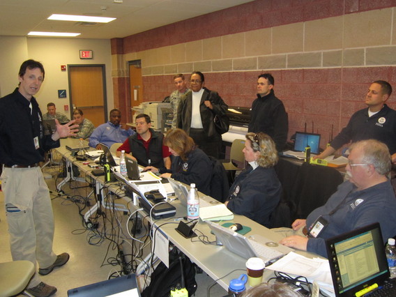 Region II IMAT team leader, Tom Fargione (far left), discusses operational planning with other IMAT team members and Region II's Defense Coordinating Element during an exercise.