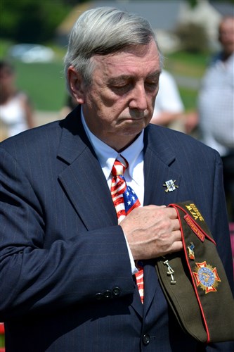 James Campbell, a Vietnam veteran from Randolph, Mass., who represented the 28th Infantry Regiment Association, said a prayer for the fallen. He later found two American troops from his hometown, buried at the Somme American Cemetery.