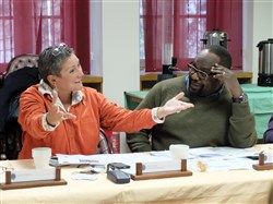 AU journalists, Jenine Coetzer (left), responds to a comment as Charles Obbo looks on during a media delegation visit, Feb. 9, 2015, at Kelley Barracks, U.S. Army Garrison, Stuttgart, Germany.  Eight journalists, who are accredited with the African Union, are here as participants of a U.S. AFRICOM-sponsored media delegation visit to learn about the command's mission and programs. (Photo by Brenda Law/U.S. Africa Command Public Affairs/Released)