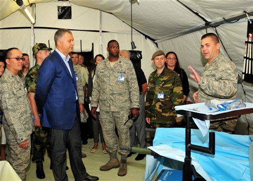 NIS, Serbia &mdash; Dragan Sutanovac, Republic of Serbia minister of defense, receives a tour of the 458th Expeditionary Medical Squadron&#39;s mobile tent hospital as part of the MEDCEUR 09 distinguished visitors&#39; day here, Sept. 10. MEDCEUR is an annual joint and combined medical exercise with a focus on major disaster response and mass casualty situations. More than 700 exercise participants from 15 countries are taking part in this year&#39;s exercise, which is hosted by Serbia. (Department of Defense photo by Air Force Staff Sgt. Markus M. Maier)