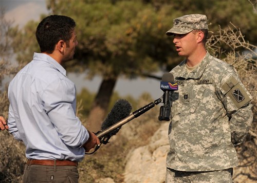 Capt. Kyle Surridge, Alpha Battery commander in the 5th Battalion, 7th Air Defense Artillery Regiment, gives a brief interview with an Israeli television reporter Oct. 23, 2012 at a ballistic missile defense position near Jerusalem. Captain Surridge and Alpha Battery were temporarily in place to support the bilateral U.S.-Israel exercise Austere Challenge 12.