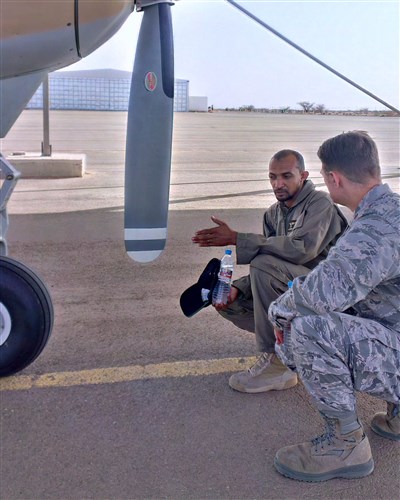 Mauritanian Air Force Master Sgt. Ahmed Beheitt, Cessna 208 Grand Caravan crew chief, discusses the mechanics of the Cessna to U.S. Air Force Maj. Michael Simons, African Partnership Flight Mauritania lead planner at Atar Airbase, Mauritania Sept. 1, 2014. Airmen from six African nations, 17 Airmen from U.S. Air Forces in Europe and Air Forces Africa as well as Air Mobility Command, arrived in Atar, Mauritania for the five-day training workshop. (U.S. Air Force photo/Master Sgt. Brian Boisvert)