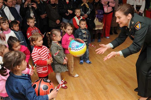 LTC Shannon M. Hancock plays with the kids at the new kindergarten in Ceamurlia de Jos, Tulcea County. U.S. Army Europe has funded the construction of a kindergarten in Ceamurlia de Jos through a Humanitarian Assistance Program overseen by the U.S. Embassy's Office of Defense Cooperation (ODC). (Lucian Crusoveanu / Public Diplomacy Office)
