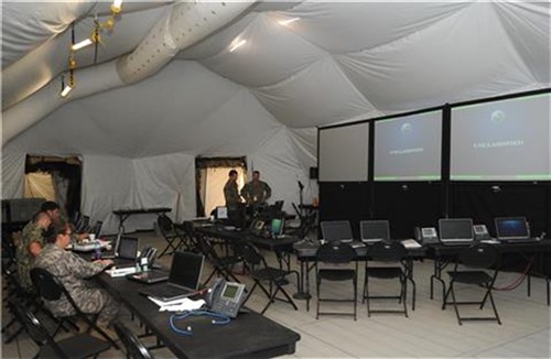 Service members from Combined Joint Task Force-Horn of Africa test computer systems in its newly purchased forward command post (FCP) at Camp Lemonnier, Djibouti, May 12, 2013. Overall, the FCP gives U.S. Africa Command and CJTF-HOA an eyes-on capability that amplifies the ability to rapidly respond to a crisis or humanitarian incident in Africa. (U.S. Air Force photo by Staff Sgt. Caleb Pierce)