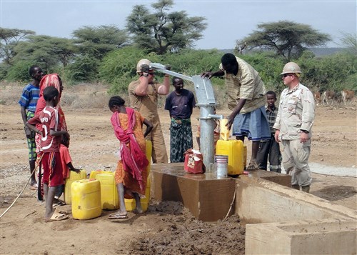 JEDANE, Ethiopia - Petty Officer 2nd Class Kevin Clayton (left) and Petty Officer 1st Class Dennis Hill, Seabees assigned to Naval Mobile Construction Battalion (NMCB) 74 Detail Horn of Africa's (Det. HOA) Water Well Team, test the pump on their recently completed water well in the village of Jedane, Ethiopia, February 15, 2011.  The 302-foot-deep well provides clear water to more than 3,400 locals and their livestock. NMCB 74 Det. HOA is deployed to support Combined Joint Task Force - Horn of Africa in building partner nation capacity and promoting regional stability through construction engineering support in accordance with the U.S. Maritime Strategy. (U.S. Navy photo by Petty Officer 1st Class Timothy Finnicum)