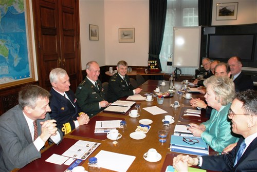 BRUSSELS, Belgium - Ambassador Mary Carlin Yates, U.S. Africa Command's deputy to the commander for civil-military activities (second from right), discusses U.S. AFRICOM activities with Ambassador Vincent Mertens de Willmars, director of the Ministry of Defense diplomatic department (left), Rear Admiral Marc Ectors, Belgian Ministry of Defense operations director (second from left), and members of the Ministry of Defense staff March 12, 2009, in Brussels. Colonel Dan Fagundes (right), U.S. Defense Attache to Belgium, and Wayne Bush, U.S. Deputy Chief of Mission to the U.S. Embassy in Brussels, also attended the meeting. Yates led a small U.S. Africa Command delegation from its headquarters in Stuttgart, Germany, to meet with Belgian defense and foreign affairs officials and African defense attachhÃs in Brussels to share information about command activities and discuss possibilities for future cooperation. (U.S. Africa Command photo by Kenneth Fidler)