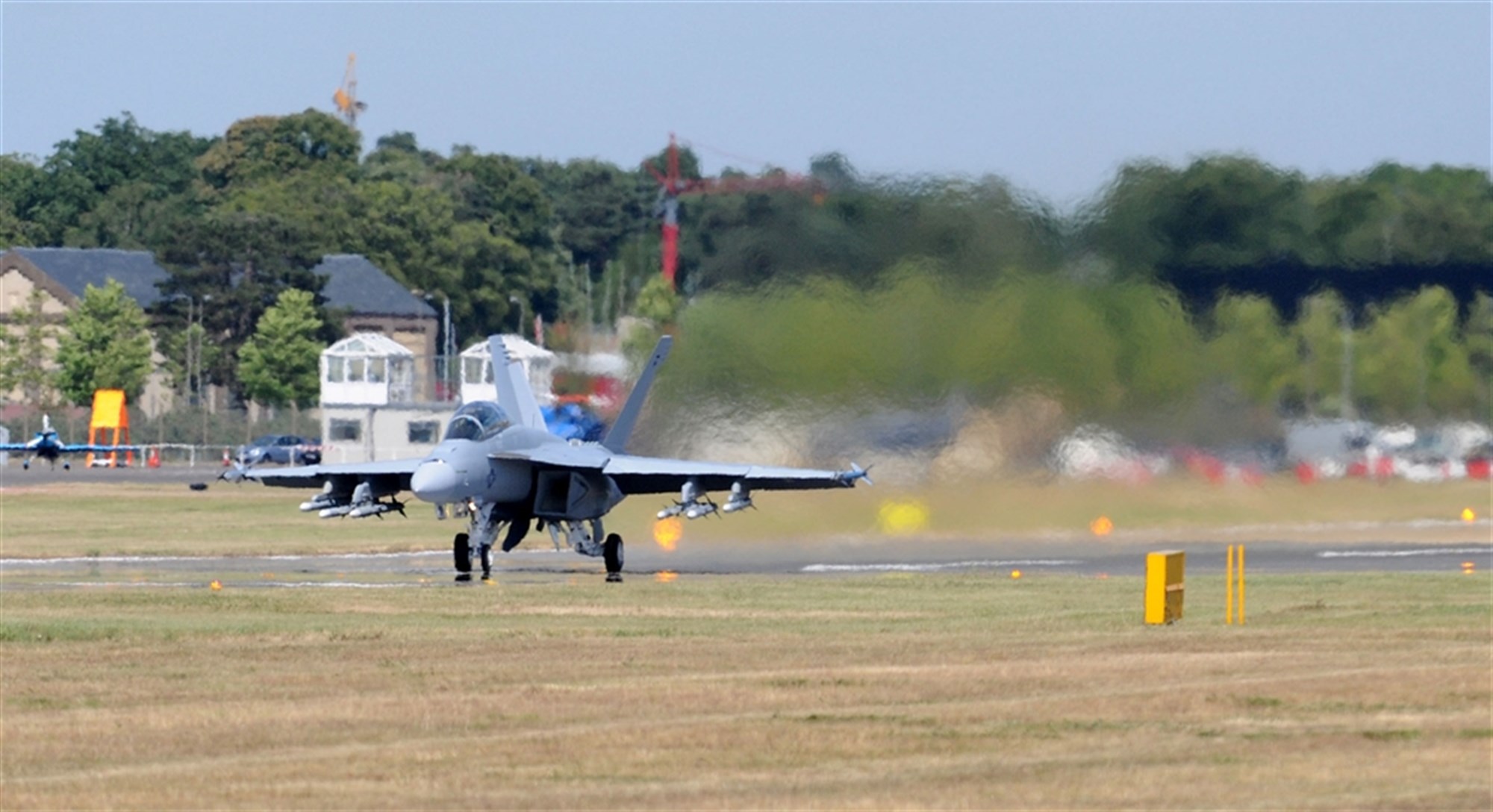 FARNBOROUGH, United Kingdom &mdash; A Navy F/A-18F Super Hornet, prepares for takeoff for an aerial demonstration during the Farnborough International Air Show July 19. The demo showcases the aircrafttâ?s handling and maneuvering capabilities during the week-long event. Nearly 70 aircrew and support personnel from bases across Europe and the United States participated in the air show. This premier global aviation event allows exhibitors to showcase their newest aerospace equipment and technology. (U.S. Air Force photo by Staff Sgt. Jerry Fleshman)