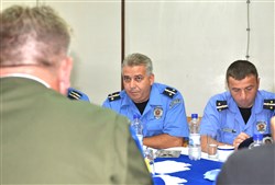 Officers from the Serbian Ministry of Internal Affairs listen to a report from a member of the European Rule of Law Mission in Kosovo, or EULEX during a coordination meeting held in Vrapce June 21.
