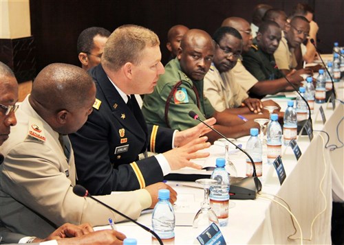 BAMAKO, Mali - U.S. Lieutenant Colonel David Schilling, chief of the U.S. Africa Endeavor 11 delegation, discusses exercise objectives with the heads of the other delegations during the AE main planning conference's first executive management board meeting January 24, 2011. The conference brought together more than 180 participants from 41 African, European and North American nations and observers from Economic Community of West African States (ECOWAS), Economic Community of Central African States (ECCAS), the Eastern African Standby Force and NATO to plan U.S. Africa Command's primary communications interoperability exercise.  (Photo by Susannah Dowell, AE11 staff)