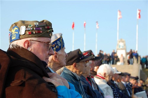 U.S. World War II veterans watch the D-Day commemoration ceremony at Utah Beach June 5, 2013.