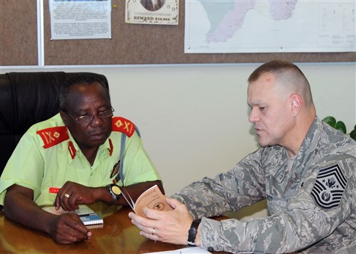 GABARONE, Botswana - Chief Master Sergeant of the Air Force James A. Roy discusses the enlisted force structure with Botswana Defense Force Air Arm Command Major General T.M. Paledi October 11, 2010, during a visit to Thebaphatshwa Air Base, Botswana. Roy and a team from Air Forces Africa spent the day discussing enlisted force development with members of the BDF. (U.S. Air Force photo by Master Sergeant Jim Fisher)