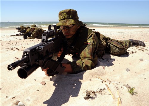 PALANGA, Lithuania – Lithuanian Special Forces members lie in formation on a beach during a Baltic Operations (BALTOPS) 2012 amphibious operation exercise, June 11. This is the 40th iteration of BALTOPS, a maritime exercise intended to improve interoperability with partner nations by conducting realistic training at sea. 