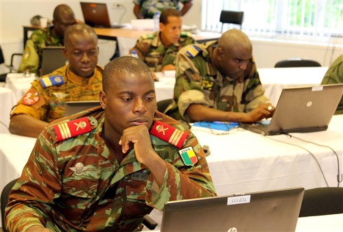 Staff members participating in Western Accord 2015 prepare for the upcoming command post exercise at Winkelman Kazerne, Harskamp, The Netherlands, July 22. The exercise benefits participating militaries and encourages them to work together in preparation for multi-national responses to peacekeeping and humanitarian operations. (U.S. Army Africa photo by Staff Sgt. Killo Gibson)