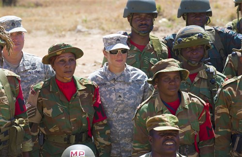 U.S. Army military police personnel with the 93rd Military Police Battalion stand with fellow military police from the Zambian Defense Force during Exercise Southern Accord 2015 in Lusaka, Zambia on Aug. 10. The annual exercise provides U.S. military, United Nations allies and the Zambian Defense Force an opportunity to work and train together as a joint, combined peacekeeping allied force. (U.S. Army Africa photo by U.S. Air Force Staff Sgt. Brian Kimball)