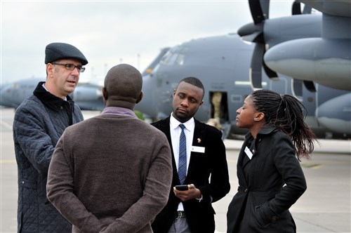 Mr. Ben Benson (far left), U.S. Africa Command's public affairs office, addresses questions from journalists from Botswana and Malawi during a tour of the Stuttgart Army Air Field, Nov. 19, 2014.  The journalists, along with a military public affairs officer from each country, were invited by AFRICOM Public Affairs and selected by U.S. embassy staff to participate in a program designed to enhance journalists' understanding of the command's mission and programs on the continent.