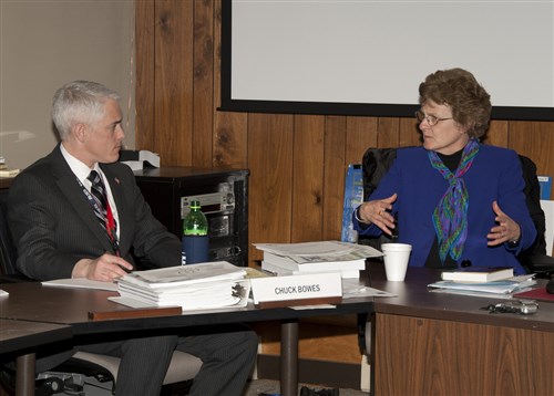 CARLISLE BARRACKS, Pa. - Margaret Culbert, a senior defense intelligence analyst for Africa at the Defense Intelligence Agency, talks with Air Force Lieutenant Colonel Chuck Bowes during a seminar discussion at the African Symposium February 1, 2011, at the U.S. Army War College, Carlisle Barracks, Pa. (Photo by Megan Clugh)