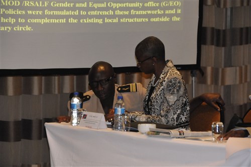 Senegalese Col. Birame Diop shares a discussion with Dr. Monde Muyangwa, director of the Africa Program for the Woodrow Wilson Center at the Regional Gender Mainstreaming Seminar, June 26, in Windhoek, Namibia. Both Diop and Muyangwa served as speakers at the first-ever week-long seminar of this topic that was attended by seven African countries.