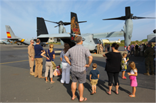 A group of United States Embassy personnel and their families gather to view an MV-22B Osprey during a static display held by Special-Purpose Marine Air-Ground Task Force Crisis Response in Dakar, Senegal, Nov 14, 2013. SP-MAGTF Crisis Response also conducted a flight demonstration of the Osprey following the more than 1,500 nautical miles long-range flight demonstration of SP-MAGTF Africa 13 Marines for a small-boat operations and marksmanship exercise with the Senegalese. (Photo by Cpl. Ryan Joyner)