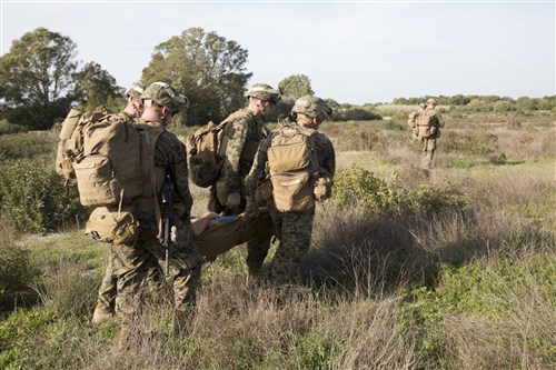 U.S. Marines with Special-Purpose Marine Air-Ground Task Force Crisis Response-Africa extract a simulated casualty during quick-response training aboard Naval Station Rota, Spain, January 23, 2016. The alert force tested the unit’s capabilities by simulating the procedures of reacting to a time-constrained, crisis-response mission. (U.S. Marine Corps photo by Sgt. Tia Nagle)