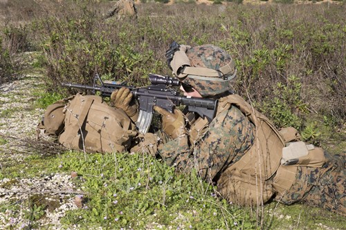 A U.S. Marine with Special-Purpose Marine Air-Ground Task Force Crisis Response-Africa provides security during quick-response training aboard Naval Station Rota, Spain, January 23, 2016. The alert force tested the unit’s capabilities by simulating the procedures of reacting to a time-constrained, crisis-response mission. (U.S. Marine Corps photo by Sgt. Tia Nagle)