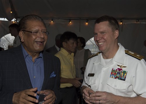 Mauritius President Kailash Purryag, left, and Rear Adm. Tom Reck, vice commander, U.S. 6th Fleet, talk at a reception held aboard the Oliver Hazard Perry-class guided-missile frigate USS Simpson (FFG 56) Feb. 3, 2015. Purryag visited Simpson while it is in Port Louis, Mauritius, after it completed the underway phase of Exercise Cutlass Express 2015. This exercise, sponsored by U.S. Africa Command, is designed to improve regional cooperation, maritime domain awareness and information sharing practices to increase capabilities of East African and Indian Ocean nations to counter sea-based illicit activity. (U.S. Navy photo by Mass Communication Specialist 1st Class David R. Krigbaum/Released)