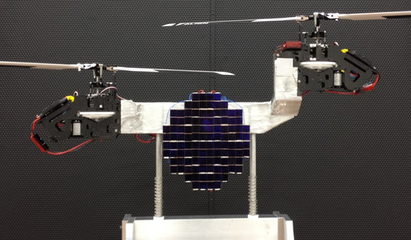 Above is a twin-propeller aerial vehicle with a laser converter mounted in the middle. The photovoltaic cells convert laser power to electrical power at high efficiency to power the two propellers. The laser converter is cooled by the downdraft created by the propellers.