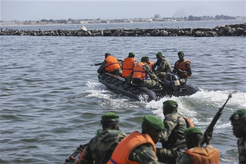 Compagnie Fusilier de Marin Commandos depart after raiding a simulated enemy position during the final exercise with U.S. service members in Dakar, Senegal, Sept. 17, 2015. The Marines and Coast Guardsmen with Special-Purpose Marine Air-Ground Task Force Crisis Response-Africa spent four weeks training the COFUMACO on basic infantry tactics and small-boat operations as a part of a Maritime Security Force Assistance mission to increase interoperability with Senegal’s and strengthen the bond between the partner nations. (U.S. Marine Corps photo by Cpl. Olivia McDonald/Released)