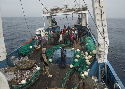 ATLANTIC OCEAN (Feb. 04, 2016) – Members of the Ghanaian Navy and U.S. Coast Guard Tactical Law Enforcement Detachment board a fishing vessel during combined joint boarding operations Feb. 04, 2016. The Military Sealift Command expeditionary fast transport vessel USNS Spearhead (T-EPF 1) is on a scheduled deployment in the U.S. 6th Fleet area of operations to support the international collaborative capacity-building program Africa Partnership Station. (U.S. Navy photo by Mass Communication Specialist 3rd Class Amy M. Ressler/Released)
