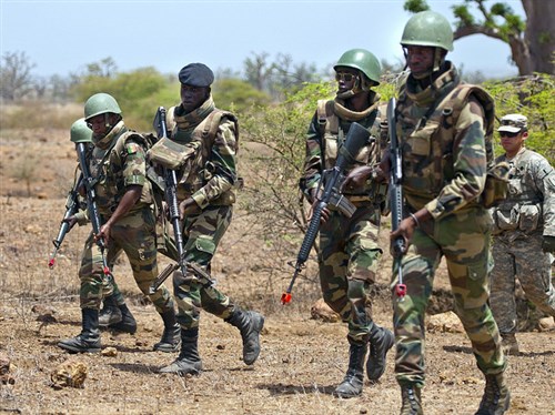 Senegalese soldiers practice live fire maneuvers during a training exercise in support of Exercise Western Accord 14, June 19. Exercise Western Accord 14 is a U.S. Africa Command sponsored annual joint training partnership exercise between the United States, the Economic Community of West African States and partner nations. The exercise, held in Senegal this year, is designed to increase interoperability between military forces and ensure the common ability to conduct peace operations throughout western Africa. (U.S. Army Africa photo by Staff Sgt. Donna Davis) 