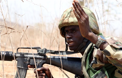 A Senegalese soldier with 1st Paratrooper Battalion gives movement orders to his team during a squad-level exercise July 14, 2016 in Thies, Senegal as part of Africa Readiness Training 16. ART16 is a U.S. Army Africa exercise designed to increase U.S. and Senegalese readiness and partnership through combined infantry training and live-fire events. (U.S. Army photo by Staff Sgt. Candace Mundt/Released)