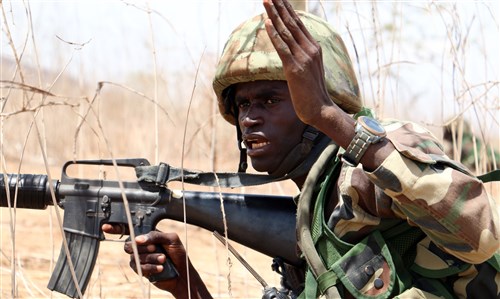 A Senegalese soldier with 1st Paratrooper Battalion gives movement orders to his team during a squad-level exercise July 14, 2016 in Thies, Senegal as part of Africa Readiness Training 16. ART16 is a U.S. Army Africa exercise designed to increase U.S. and Senegalese readiness and partnership through combined infantry training and live-fire events. (U.S. Army photo by Staff Sgt. Candace Mundt/Released)