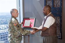 Deputy Commander LTC Landon Raby, Mobile District presents Willie Key with retirement plaque. 