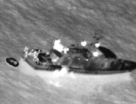 Feb. 4, 2006 - Infrared image taken from U.S. Navy P-3C Orion maritime patrol aircraft, assisting in search and rescue operations for survivors of the Egyptian ferry Al Salam Boccaccio 98 in the Red Sea, shows a rescue vessel alongside a life raft. The aircraft, assigned to the Golden Swordsmen of Patrol Squadron (VP-47), flew for almost 15 hours during the mission to assist local authorities in the search efforts. VP-47 is homeported at Marine Corps Base Hawaii, Kaneohe Bay, and is currently supporting missions in the U.S. Central Command area of operations. U.S. Navy photo.