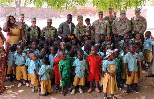 Soldiers from 2nd Infantry Brigade Combat Team, 3rd Infantry Division stationed in Garoua, Cameroon, present school supplies purchased with Spirit of America funding to the Cameroon Air Base 301 Pre-School on April 8. Soldiers from 3rd Inf. Div. provide non-lethal support to their Cameroonian hosts as part of U.S. Africa Command. (U.S. Army Africa photo by Spc. Jonathan Singletary/Released)