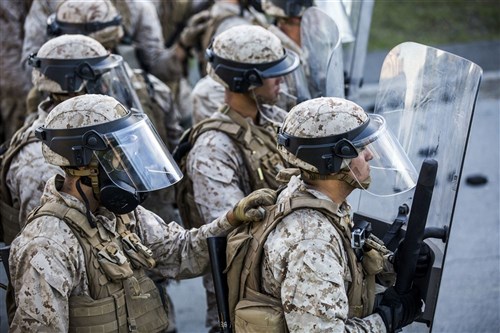 U.S. Marines guard a simulated embassy during a riot control exercise at the National Gendarmerie Tactical Training Center in Saint-Astier, France, Oct. 9. The Marines with Special-Purpose Marine Air-Ground Task Force Crisis Response-Africa worked with French Gendarmes, continuing a strong partnership between the two units. (U.S. Marine Corps photo by Staff Sgt. Vitaliy Rusavskiy)