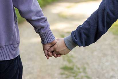 	two people holding hands  