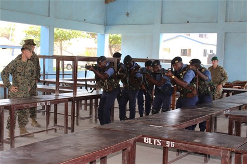 U.S. Marines and U.K. Royal Marine Commandos teach Ghanaian Navy sailors room-clearing techniques, Oct. 22, in Sekondi, Ghana. U.S. Marines and U.K. Royal Marine Commandos trained the Ghanaian Navy sailors as part of the Africa Partnership Station, which is a U.S. Naval Forces Africa initiative that aims to increase the maritime safety and security capacity of African partners through collaboration and regional cooperation through engagement exercises that build toward self-sustained African security of the maritime domain. 