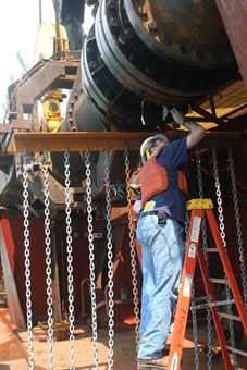 ERDC Research Hydraulic Engineer Tim Welp checks the movement of &quot;tickler chains&quot; designed to move sea turtles out of the way of dredging activities. The chains form a curtain extending off the dredging drag arm approximately 25 feet ahead of the draghead.

