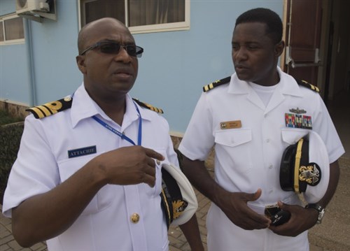 Lt. Maxwell Annani, right, speaks with his Ghanaian counterpart before the Exercise Obangame Express closing ceremony March 27, 2015. Obangame Express is a U.S. Africa Command-sponsored multinational maritime exercise designed to increase maritime safety and security in the Gulf of Guinea. (U.S. Navy photo by Mass Communication Specialist 1st Class David R. Krigbaum/Released)