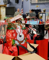 A bunch of presents and boxes on display at a department store.