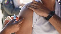 A member of the 49th Medical Group administers the influenza vaccine to an Airman on Oct. 4, 2016 at the base’s drive-thru immunization clinic. The 49th MDG set up the drive-thru immunization clinic in a lot across the street from the 49th MDG building to make it easier for Holloman Airmen to obtain their annual flu shot. The influenza vaccine is a preventative measure against the flu. The 49th MDG staff administered the vaccine to 720 Airmen. (U.S. Air Force photo by Airman 1st Class Alexis P. Docherty) 